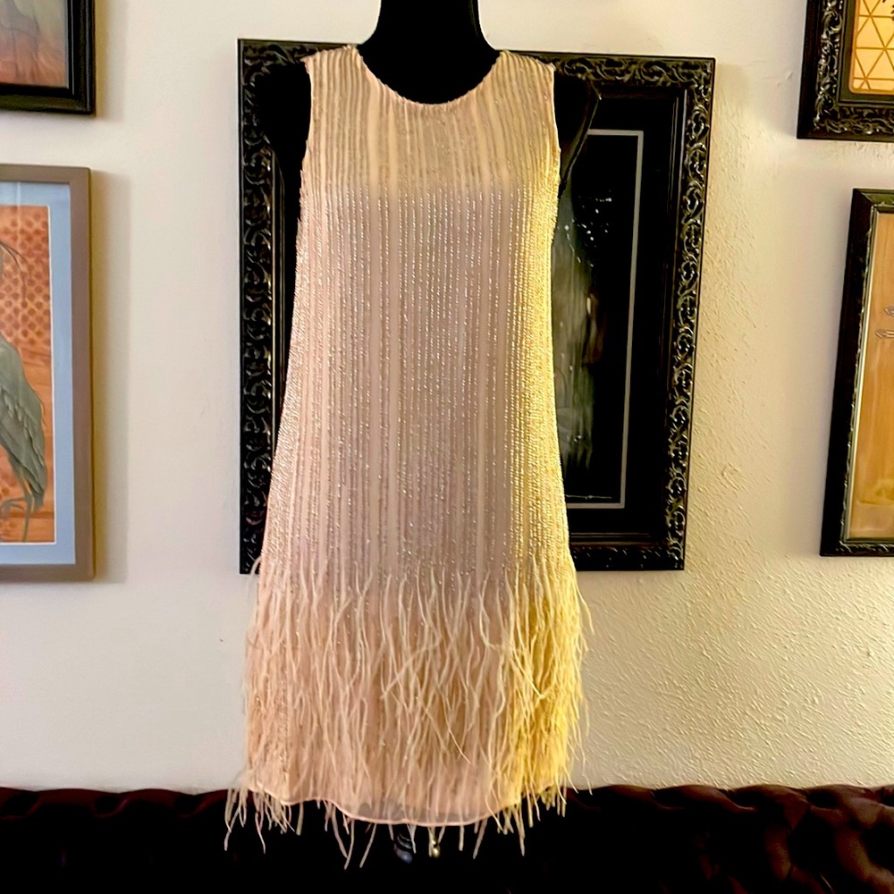 Incredible Parker heavily beaded dress with feathers.